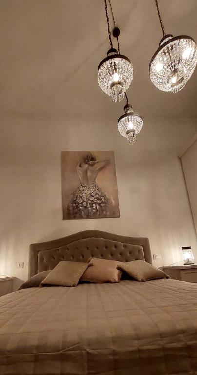 Posteľ alebo postele v izbe v ubytovaní LA CASA SOTTO IL CASTELLO