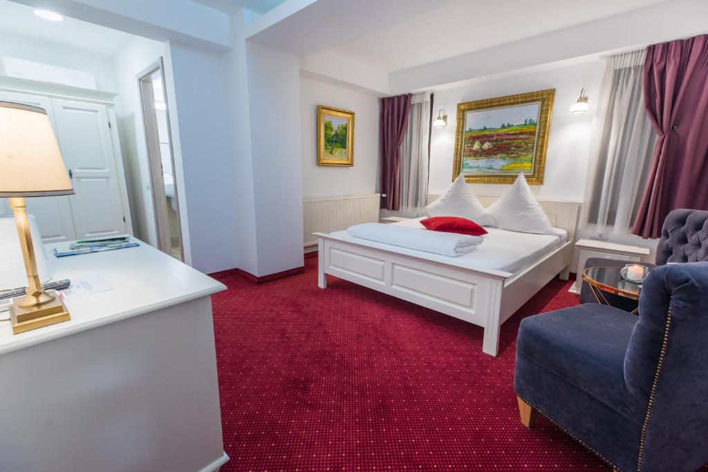 Un pat sau paturi într-o cameră la Hotel Casa David