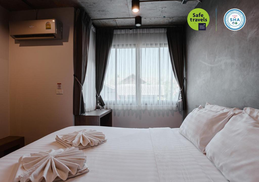 Postel nebo postele na pokoji v ubytování the echo hotel