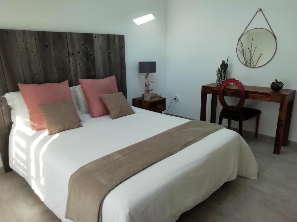 Postel nebo postele na pokoji v ubytování Appartement au dessus de la maison du Saunier