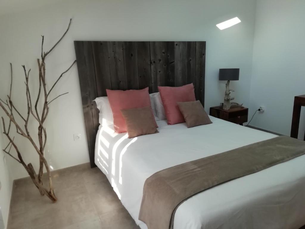 Postel nebo postele na pokoji v ubytování Appartement au dessus de la maison du Saunier