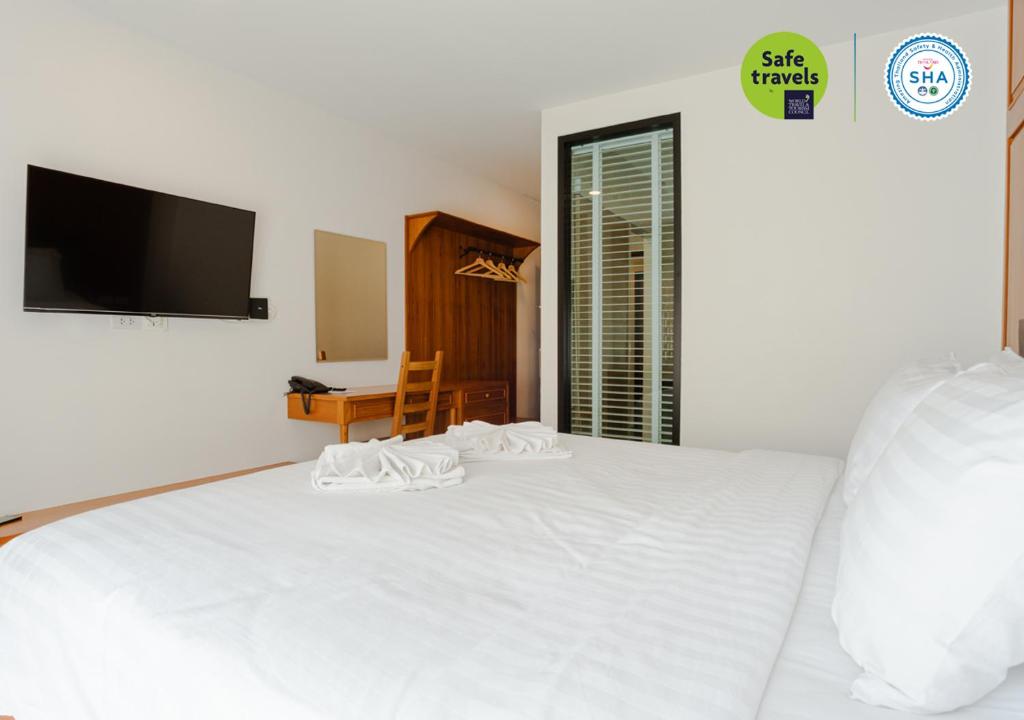 Postel nebo postele na pokoji v ubytování the echo hotel