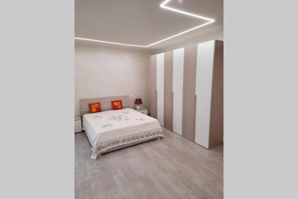 A bed or beds in a room at Chez Lulù