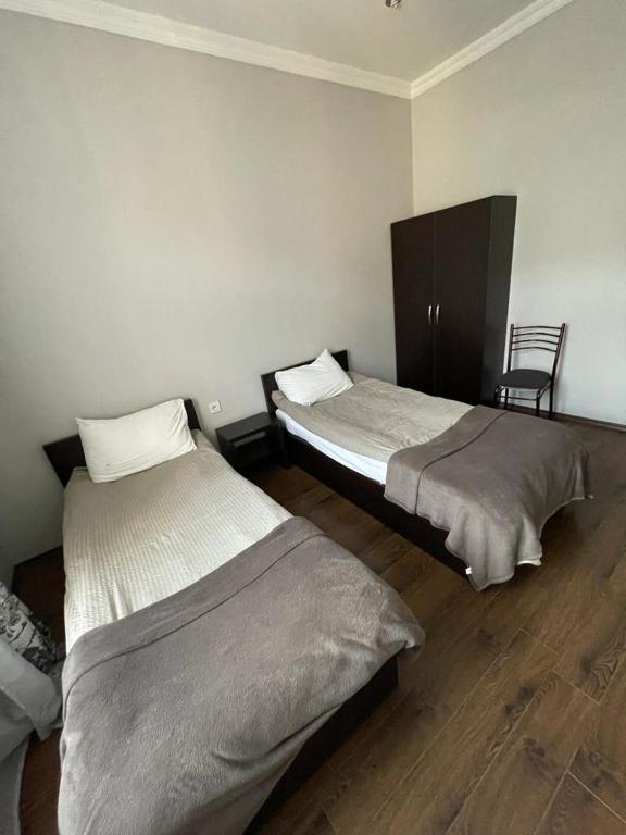 Postel nebo postele na pokoji v ubytování Guesthouse Mestia 32