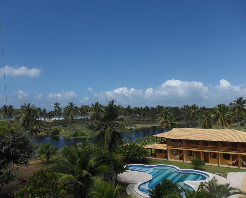 an aerial view of a resort with a pool at Pousada Anga in Baixio