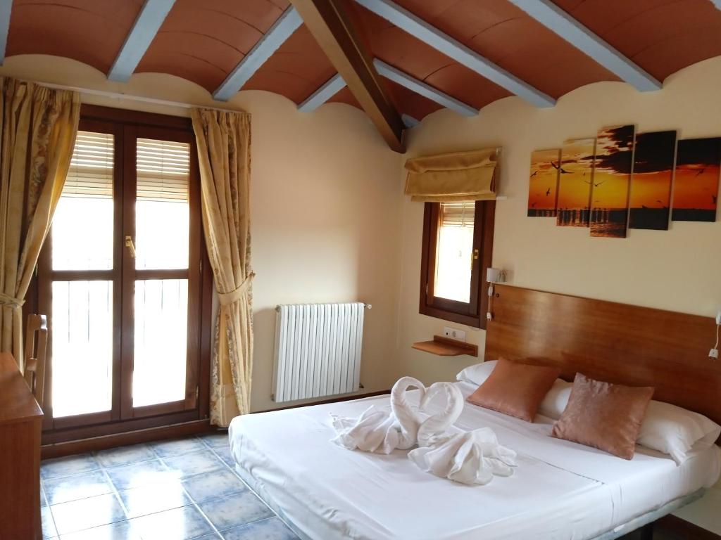 Postel nebo postele na pokoji v ubytování Hotel El Zorro