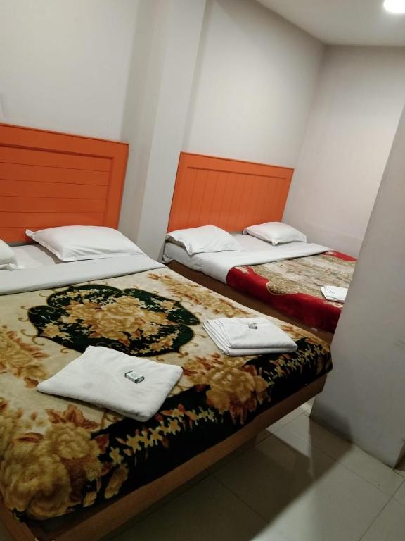 Postel nebo postele na pokoji v ubytování Hotel Preethi Palace