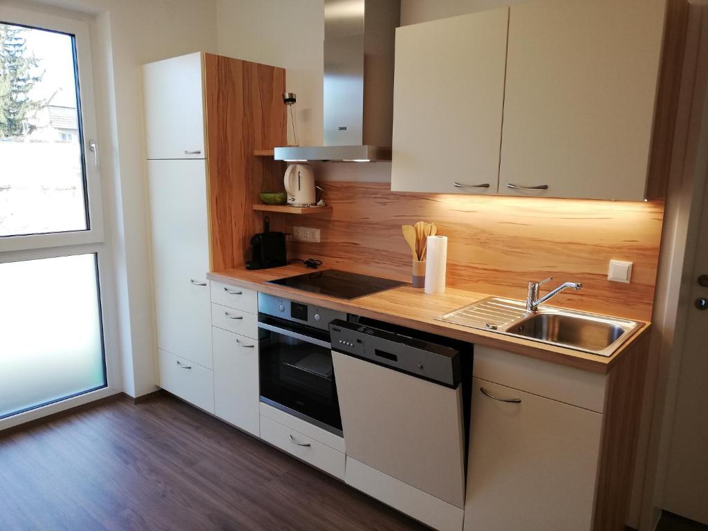 Kuchyň nebo kuchyňský kout v ubytování Ferienbungalows Vital