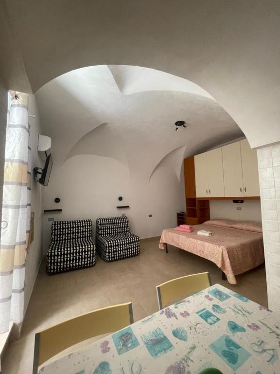מיטה או מיטות בחדר ב-Dimora Nel Borgo
