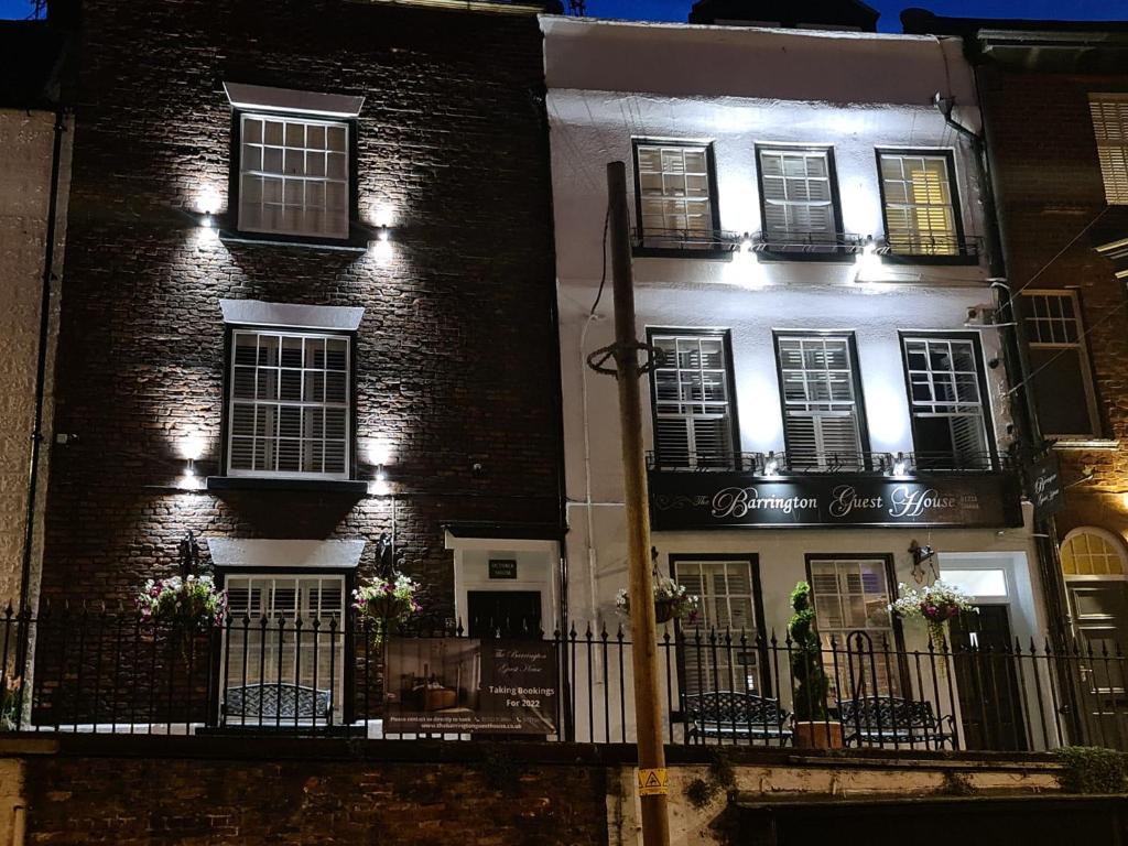 a black and white building with lights on it at The Barrington Guesthouse in Scarborough