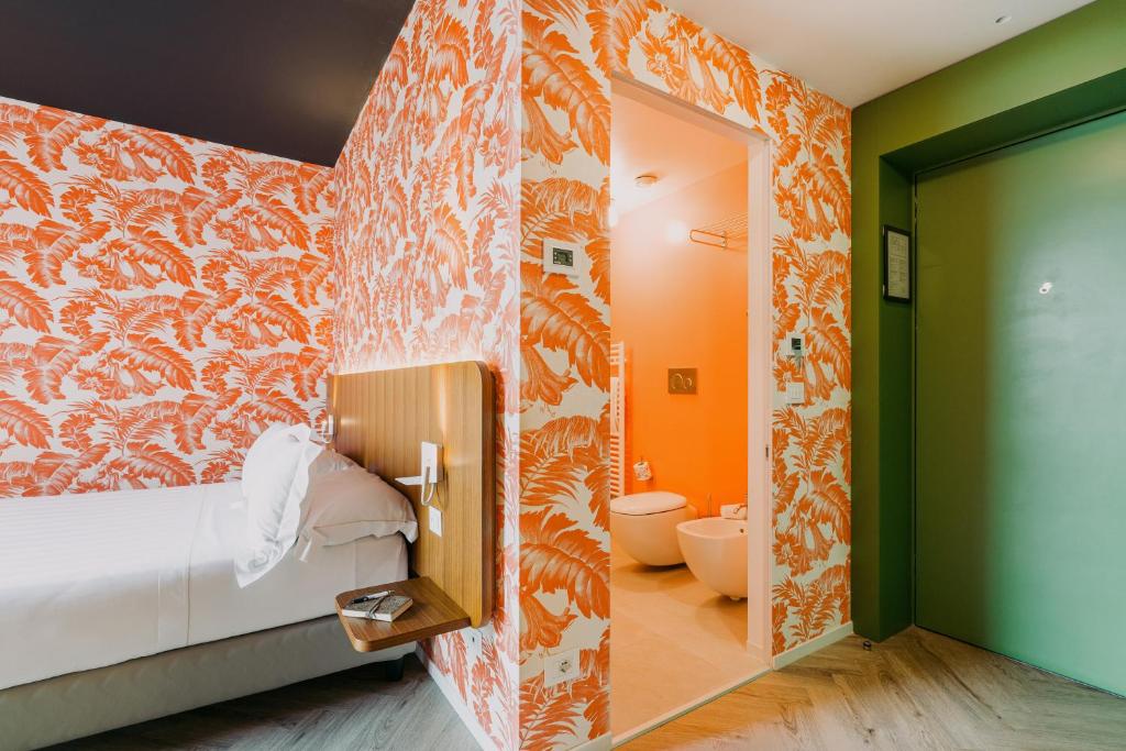 Postel nebo postele na pokoji v ubytování Collini Rooms Hotel