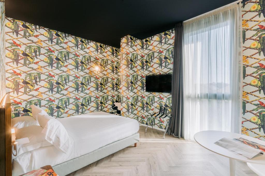 Postel nebo postele na pokoji v ubytování Collini Rooms Hotel