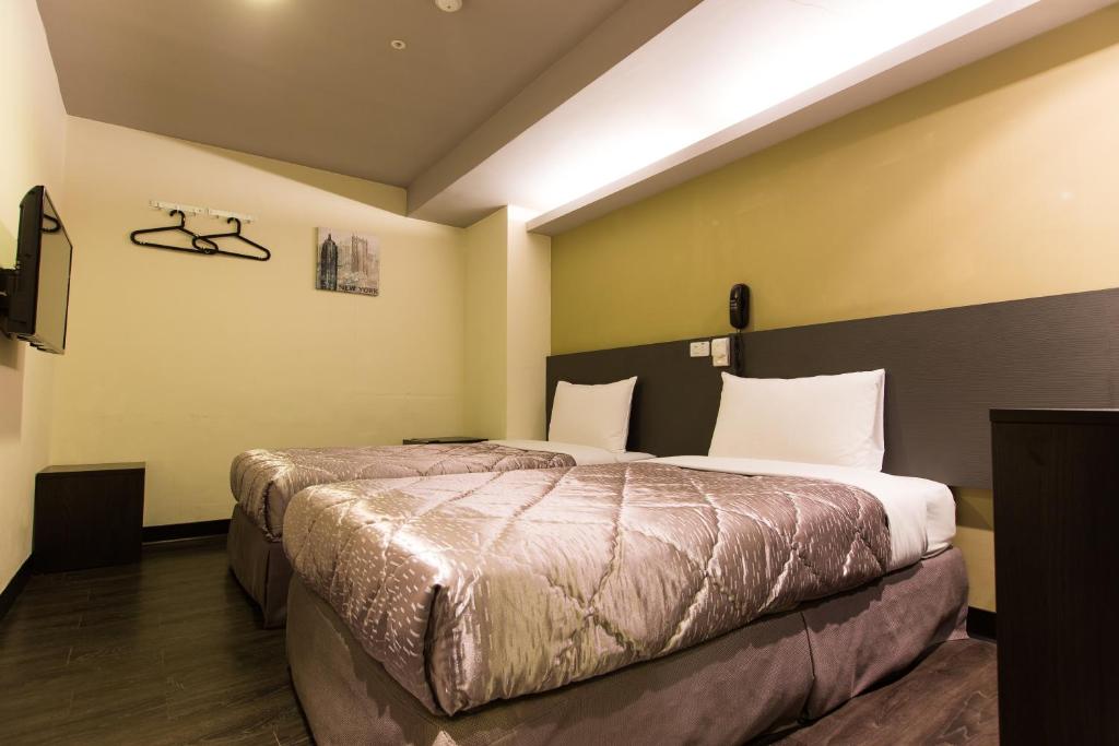 Postel nebo postele na pokoji v ubytování Chance Hotel