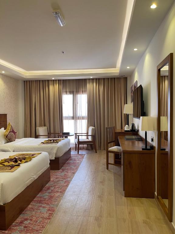 Postel nebo postele na pokoji v ubytování Alsahwa Hotel