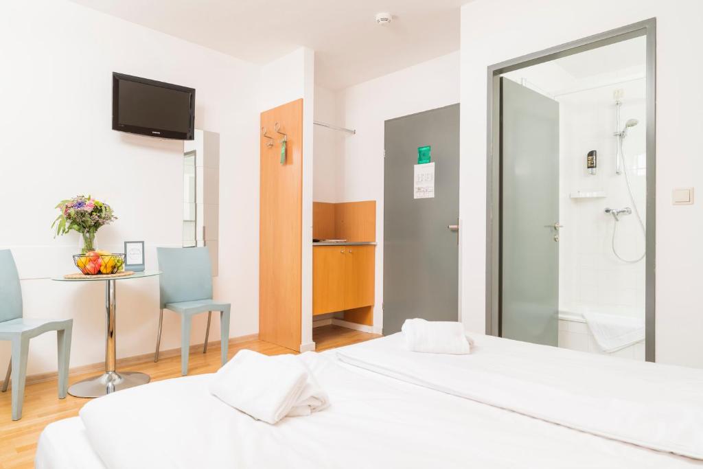 Letto o letti in una camera di Art Hotel Vienna