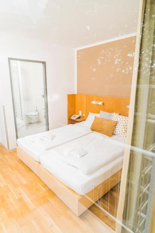 Letto o letti in una camera di Art Hotel Vienna
