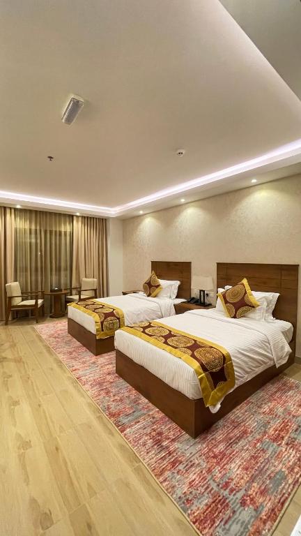 Postel nebo postele na pokoji v ubytování Alsahwa Hotel