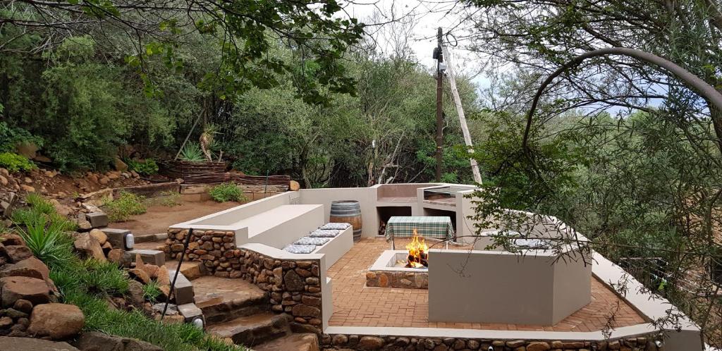 a backyard with a fire pit and a fire pit at Mountain Gem in Bloemfontein