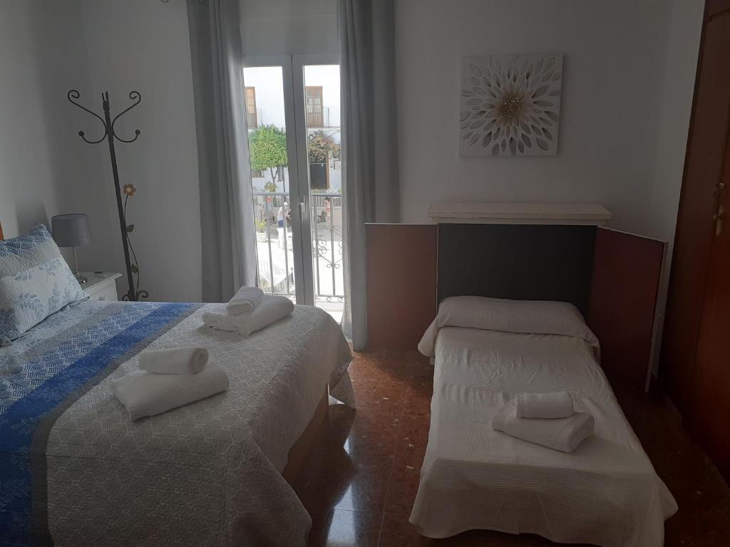 Postel nebo postele na pokoji v ubytování Casa Rural Plaza Zahara Buenas Vistas