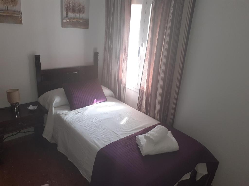 Postel nebo postele na pokoji v ubytování Casa Rural Plaza Zahara Buenas Vistas