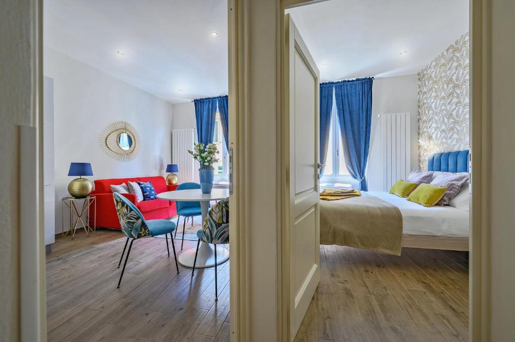 A bed or beds in a room at Via Macci, 59 - Florence Charming Apartments - Stylish apartments in a vibrant neighborhood with so comfortable beds!