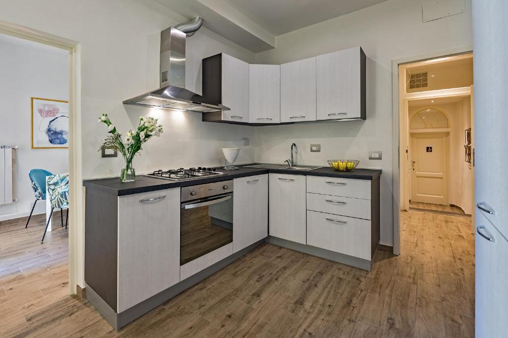A kitchen or kitchenette at Via Macci, 59 - Florence Charming Apartments - Stylish apartments in a vibrant neighborhood with so comfortable beds!