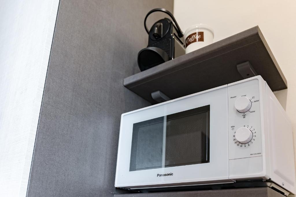 A kitchen or kitchenette at Via Macci, 59 - Florence Charming Apartments - Stylish apartments in a vibrant neighborhood with so comfortable beds!