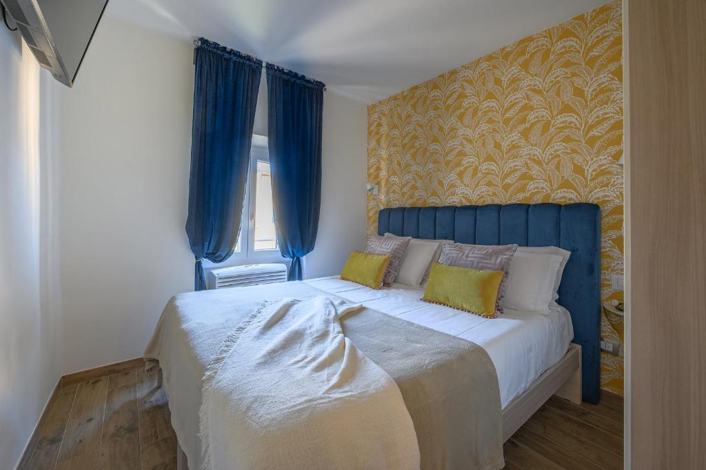 A bed or beds in a room at Via Macci, 59 - Florence Charming Apartments - Stylish apartments in a vibrant neighborhood with so comfortable beds!