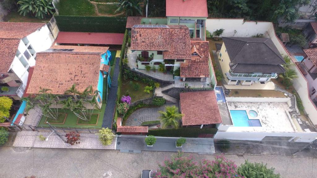 an overhead view of a house with a yard at Sweet Rio Residence Taquara in Rio de Janeiro