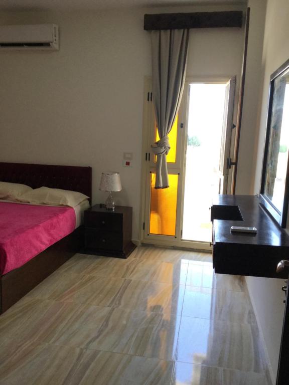 Postel nebo postele na pokoji v ubytování Lady Queen Apartment
