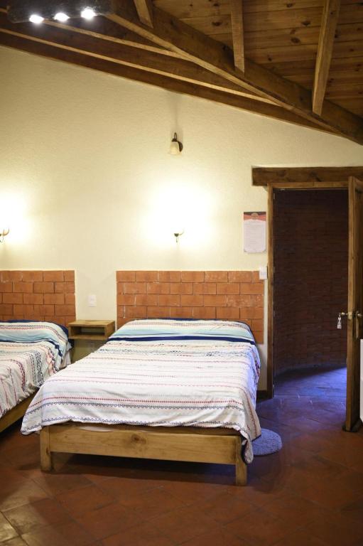 Postel nebo postele na pokoji v ubytování Hotel La Casona Real