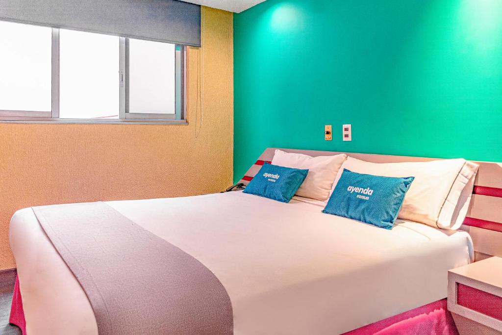 Кровать или кровати в номере Ayenda Frida Costa Azul