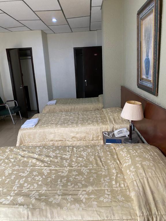 Postel nebo postele na pokoji v ubytování Hotel Rizzo