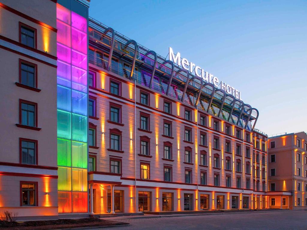 a building with colored lights on the side of it at Mercure Riga Centre in Rīga