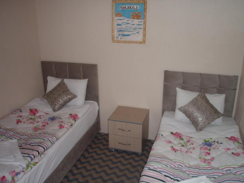 Postel nebo postele na pokoji v ubytování Hotel Pamukkale