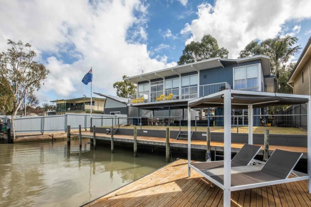 a house on a dock next to a body of water at 14 Randell Street, Mannum in Mannum