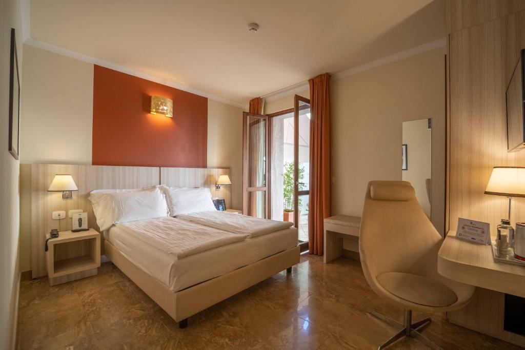 Postel nebo postele na pokoji v ubytování Hotel della Signoria