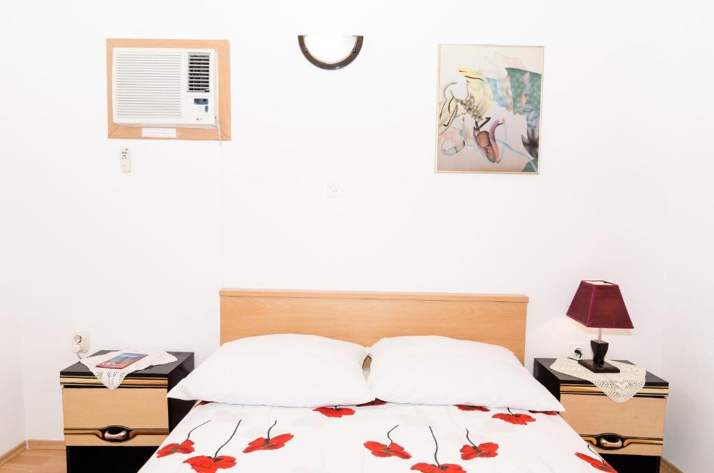 Postel nebo postele na pokoji v ubytování Guest House Dada