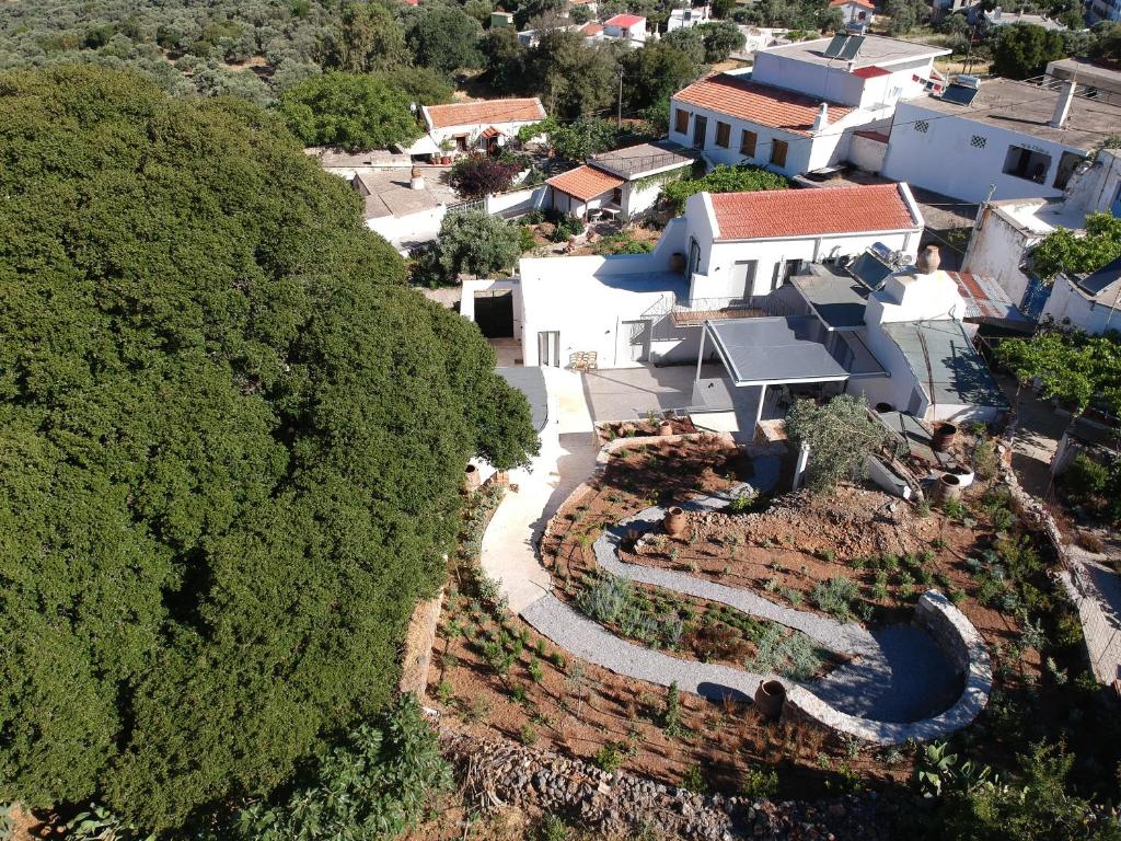 an aerial view of a house with a river at Fourfouras Cottage in Fourfourás