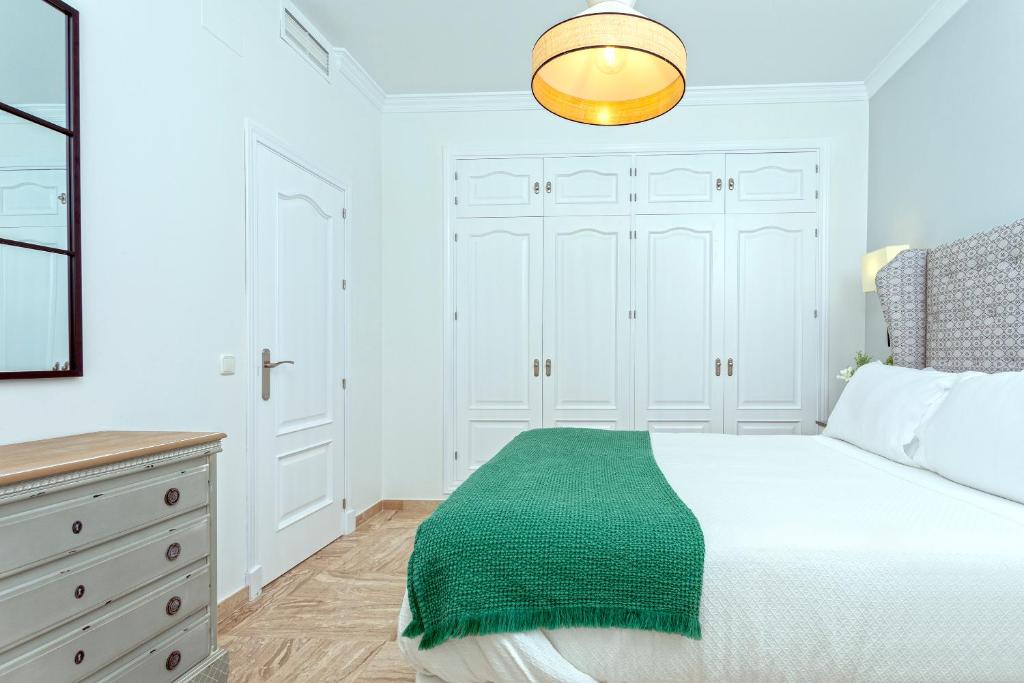 Postel nebo postele na pokoji v ubytování Genteel Home Mirador de La Barrosa