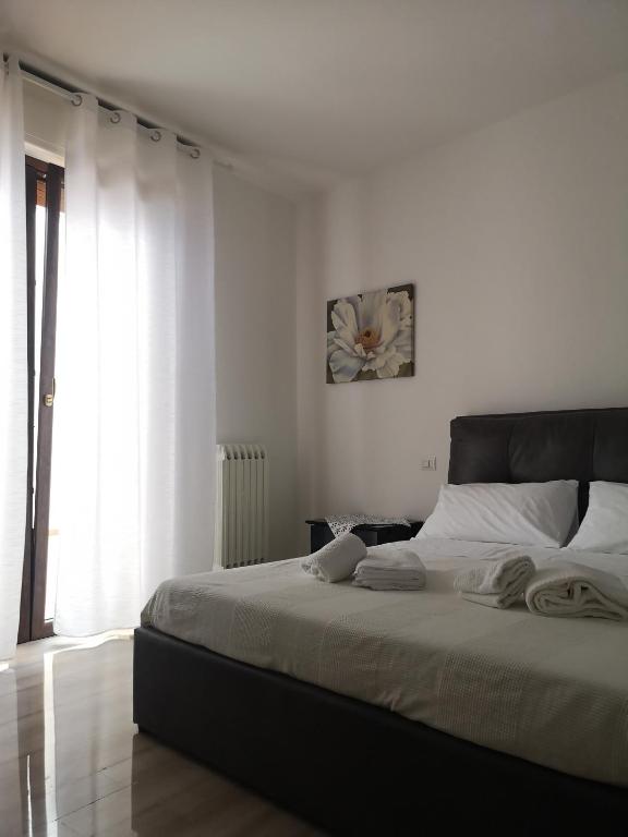 Postel nebo postele na pokoji v ubytování Muccino B&B