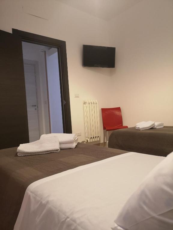 Postel nebo postele na pokoji v ubytování Muccino B&B