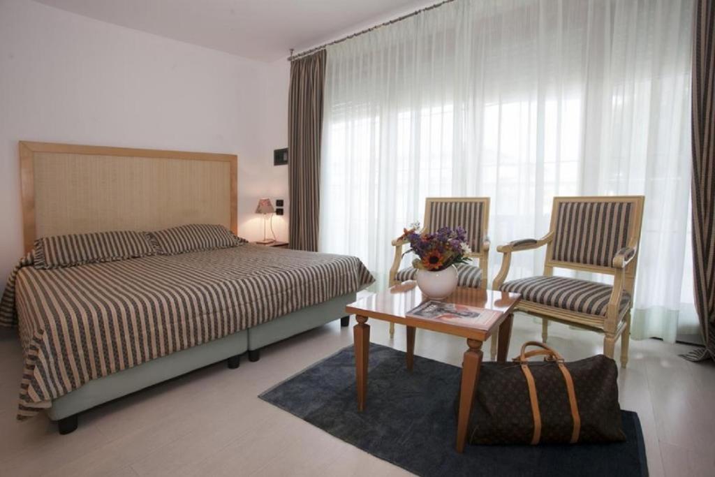 Letto o letti in una camera di Hotel Centrale