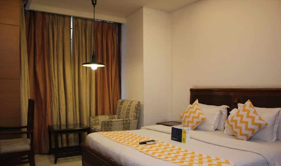 Postel nebo postele na pokoji v ubytování Hotel Good Will Residency - Cyber City Gurgaon