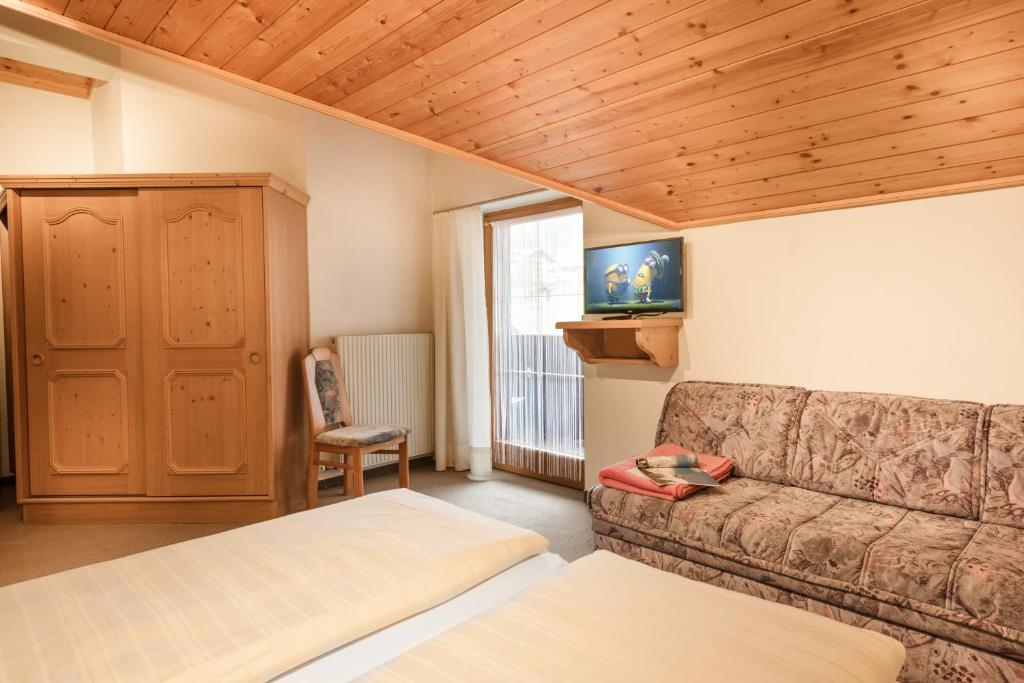 Postel nebo postele na pokoji v ubytování Gästehaus Gratz - inklusive Eintritt in die Alpentherme