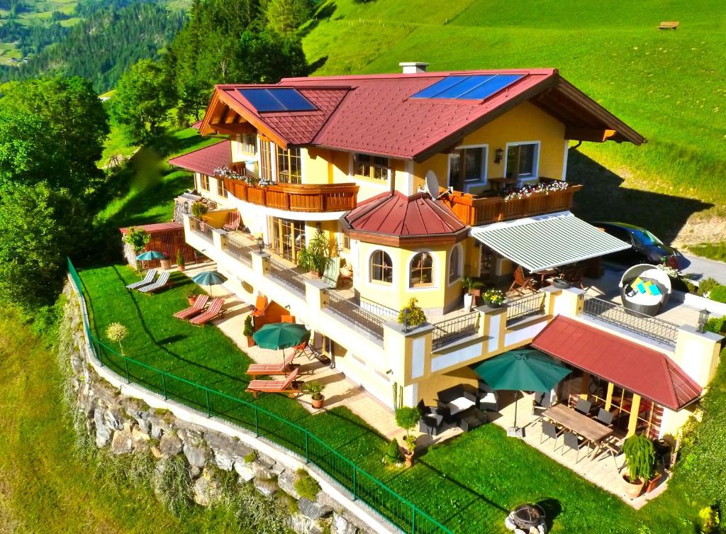 an aerial view of a house with solar panels on it at Appartementhaus Unterkofler in Grossarl
