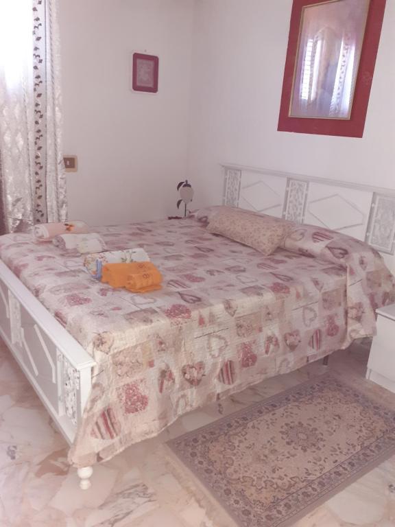 Postel nebo postele na pokoji v ubytování CASA DEGLI OLEANDRI
