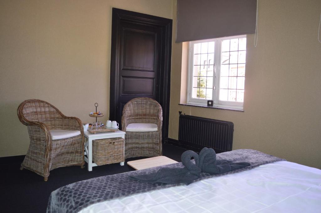 Postel nebo postele na pokoji v ubytování Luxury Spa Hotel - Francofolies