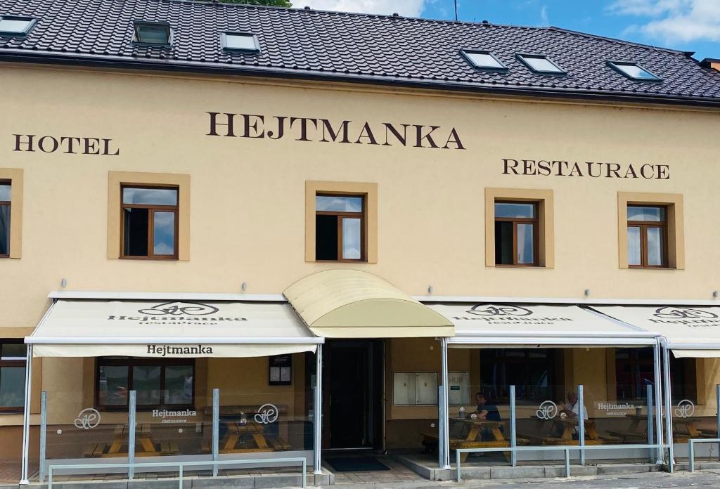a hotel in the center of a building with windows at Hotel Hejtmanka in Mladá Boleslav