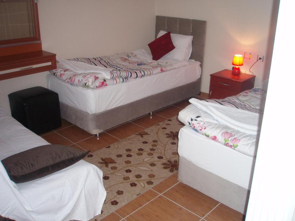 Postel nebo postele na pokoji v ubytování Hotel Pamukkale